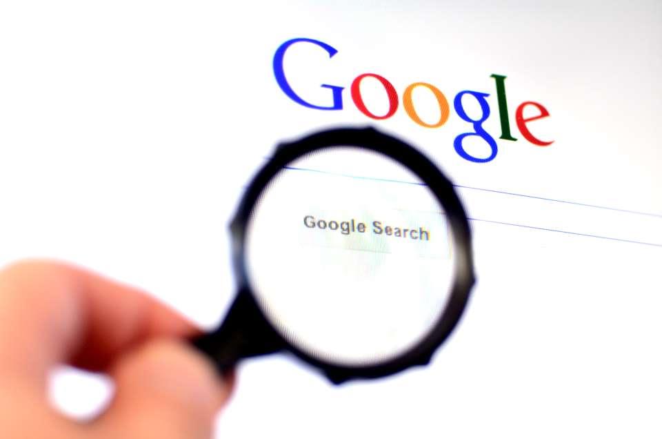 Magnifying glass looking at Google search screen